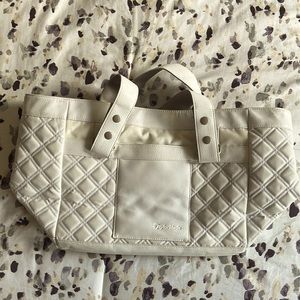 Taylor made satchel bag with lots of inside compartments for electronic devices.